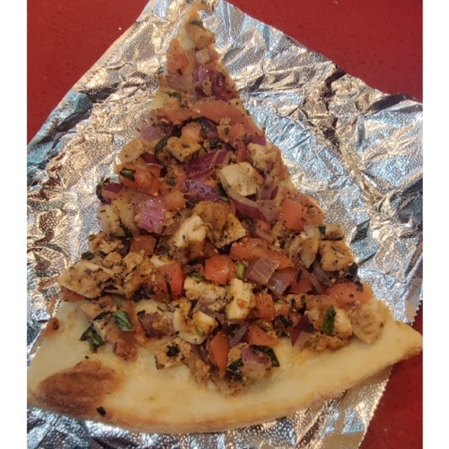 Chicken Tomato and Red Onion Pizza Slice.