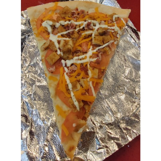 Bacon Chicken Ranch Pizza Slice.